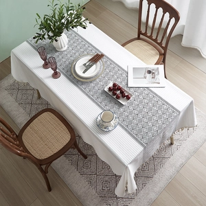 French style cotton linen tablecloth with geometric patterns and tassel edges on dining table