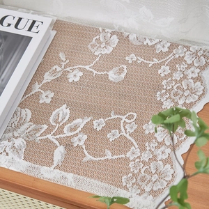 French vintage white lace curtain with floral patterns on a rustic wooden table setup