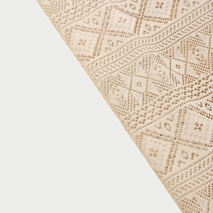 Bohemian beige lace tablecloth with geometric hollow patterns and fringe edge detail