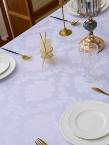 Detail view of light purple damascus jacquard tablecloth with elegant floral patterns