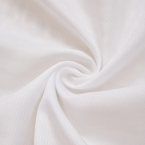 Macro view of white herringbone weave fabric texture for ruffles and cafe curtains