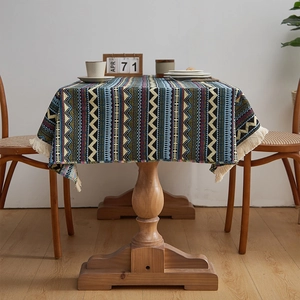 Bohemian style tablecloth with multi-color geometric patterns and white fringe tassels