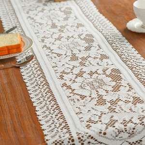 Elegant white lace table runner with French retro floral patterns and scalloped edges