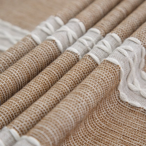 Linen blend tablecloth with brown weave texture and white hand-stitched embroidery