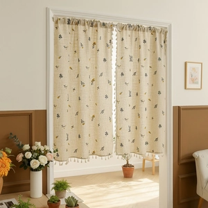 Linen door curtain with wheat embroidery and tassels in a minimalist Japanese style