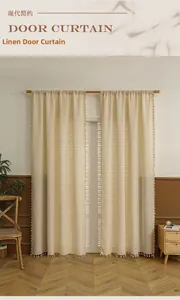 Close-up of light beige linen door curtain with delicate fringe detail and pole pocket