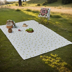 Waterproof picnic mat with yellow floral pattern for outdoor camping and picnic use
