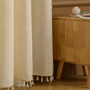 Minimalist beige linen blend door curtain with decorative bottom tassels and natural texture