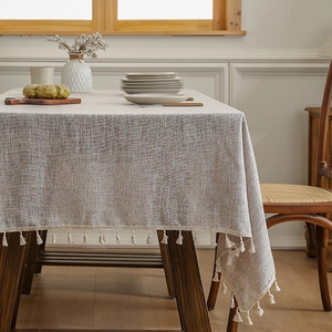 Linen blend rectangular tablecloth with tassels in oat color for wooden tables