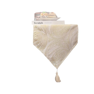 Luxurious gold textured table runner with beige tassel for elegant dining decor