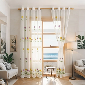 Sheer white curtains with tulip embroidery and grommet top for living room windows
