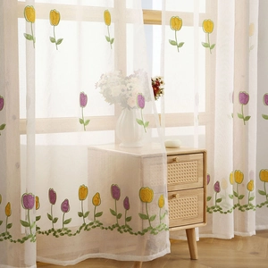 White sheer curtain with colorful tulip embroidery for a cozy living room or bedroom