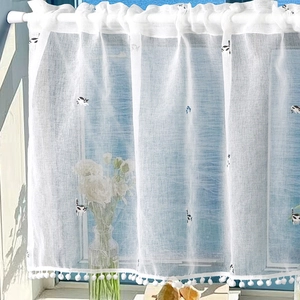 White cafe curtain with embroidered cats and pompom fringe for kitchen windows