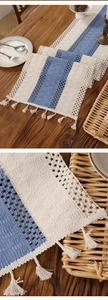 Macro shot of boho crochet table runner with rustic tassels and blue striped knit detail