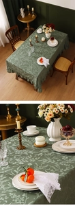 Macro detail of dark green jacquard lace tablecloth with ruffled edges and plant pattern