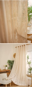 Detail of beige lace curtain featuring vertical stripes and elegant floral patterns