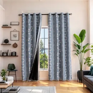 Blue blackout curtains with white floral patterns and elegant tassel trim for bedroom