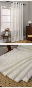 Detailed macro view of white lace curtains with vintage floral hollow embroidery texture
