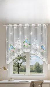 Detail of floral embroidery on white lace cafe curtain with wavy hem and rod pocket