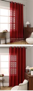 Detail view of red hollow lace curtains with grommets showing texture and light filtration