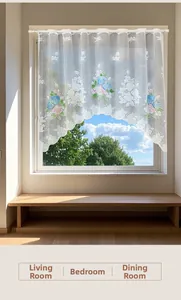Detailed shot of white lace kitchen curtain with colorful floral embroidery on a rod