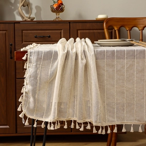 Minimalist Japanese linen table runner with brown stripes and decorative fringe edges