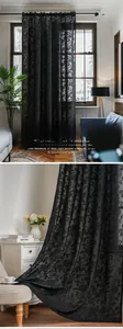 Detailed close-up of black floral lace curtain fabric showing intricate hollow-out embroidery