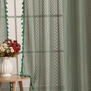 Dark green lace curtain with geometric hollow crochet patterns and green tassel trim accents