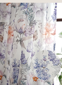 Detailed macro view of butterfly and floral print on semi-blackout curtain fabric