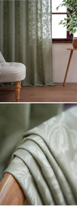 Detailed macro view of retro Damascus floral jacquard fabric in sage green lace