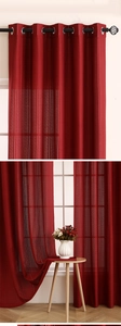 Close-up of dark red striped sheer curtain with silver grommets and textured mesh fabric