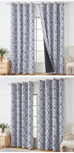 Detail of blue floral curtains with heavy black blackout lining and metal grommets