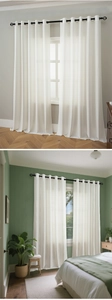 Detailed view of white vertical striped sheer curtains with black metal grommets set of 2