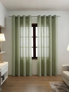 Detail of light green semi-transparent grommet curtains with subtle vertical stripes