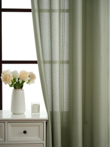 Detail of light green sheer curtain with vertical stripe texture and breathable mesh fabric