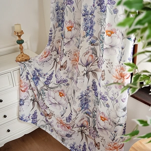 Floral curtain with butterfly and lavender print in a cozy bedroom setting