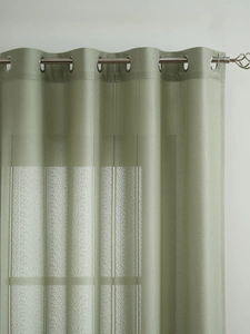 Detailed close-up of sage green curtain with vertical stripes and silver metal eyelets