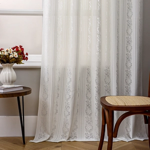 White semi-transparent lace curtains with elegant grey floral embroidery for cozy living rooms