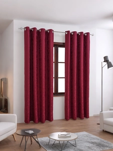 Detail of burgundy blackout curtains featuring elegant floral jacquard pattern
