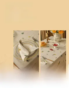 Detailed view of floral embroidery and tassel fringe on cotton linen tablecloth