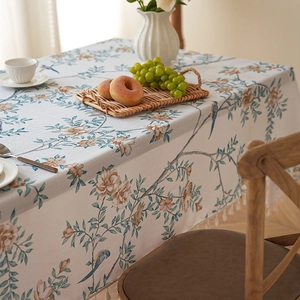 Thick faux linen tablecloth with bird and floral prints and white tassel edges