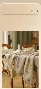 Detail of floral embroidery and fringe edge on wrinkle-resistant cotton linen tablecloth