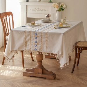 Cream rectangular waterproof tablecloth with geometric diamond embroidery and tassel edges