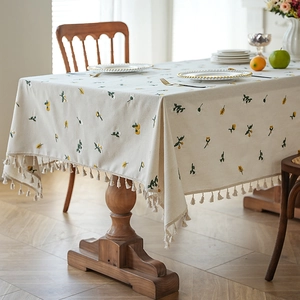 Waterproof cream tablecloth with yellow floral embroidery and fringe tassels for dining table
