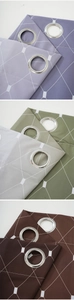 Detail showing grommet blackout curtains with geometric patterns in various colors