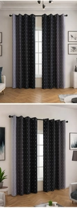 Detail view of blackout curtains with black-grey gradient and white diamond grid pattern