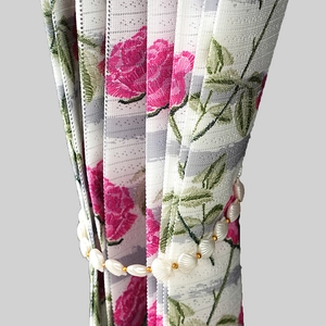 Floral print curtain with pearl and shell tieback for elegant home kitchen partition
