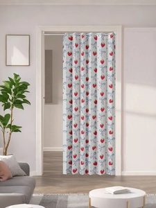 Detail of folding door curtain with cute strawberry and blue bow print for home decor