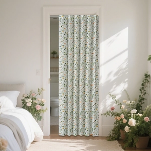 Detail of white floral folding door curtain with green leaves and yellow blossoms