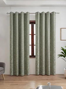 Close-up of Morandi green blackout curtain with floral jacquard and silver grommets